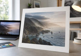 Art print proof compared with a dim screen preview in a studio color check