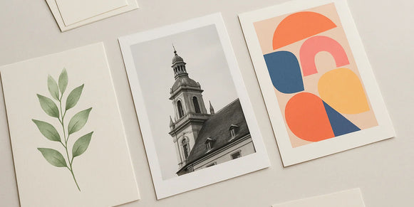Three distinct custom art prints on fine art and photo papers on a studio table
