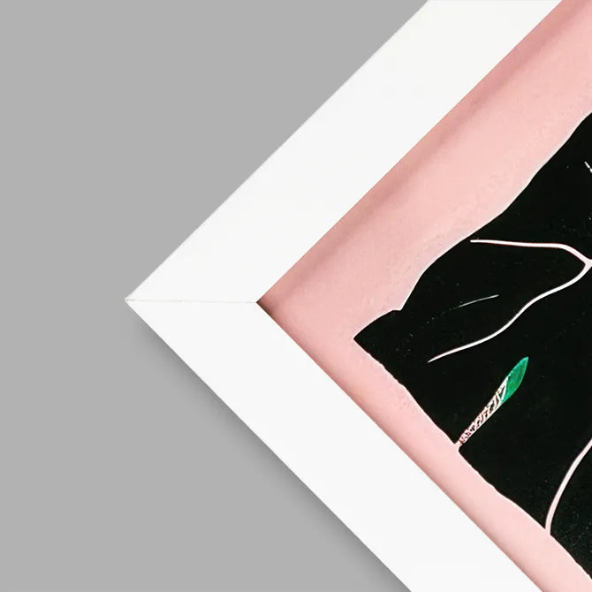 Close-up of a white framed print corner with pink artwork