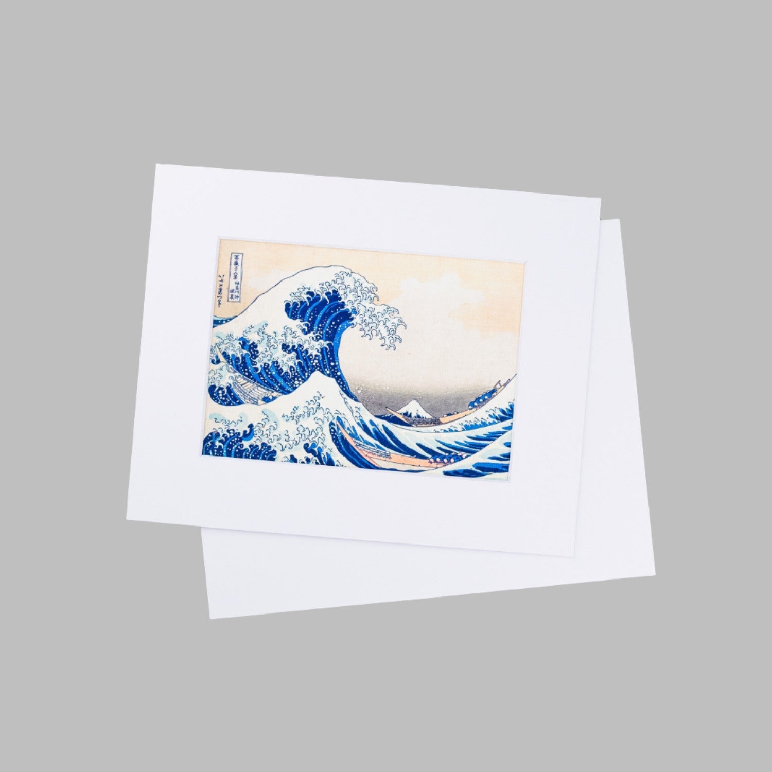 Two finished Matting Package Prints with white mats and backing boards