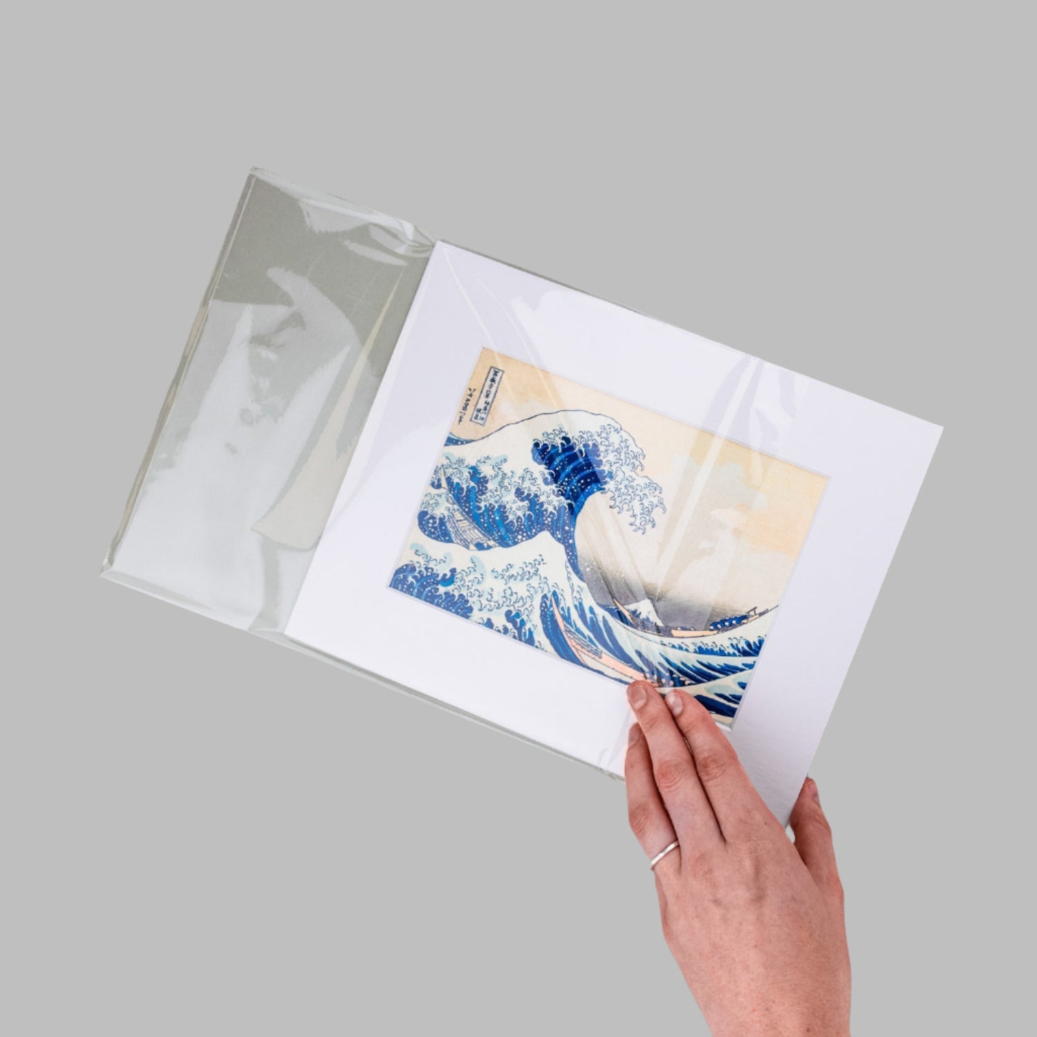Matting package print with bevel-cut mat, backing board, and clear protective bag