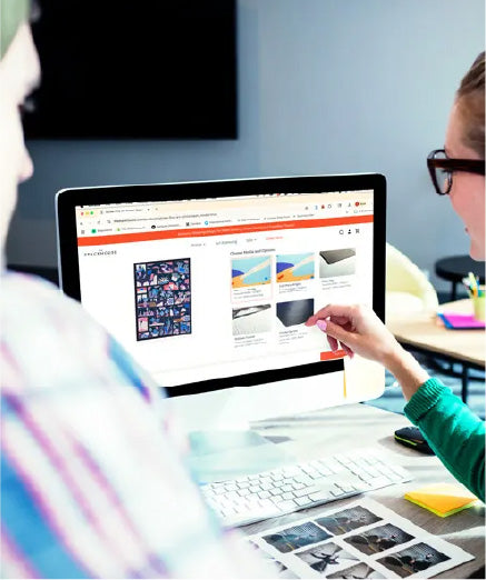 Person at laptop reviewing an artwork file